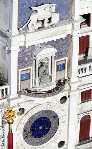 Lion and statue of the clock tower in saint mark square in venic photo