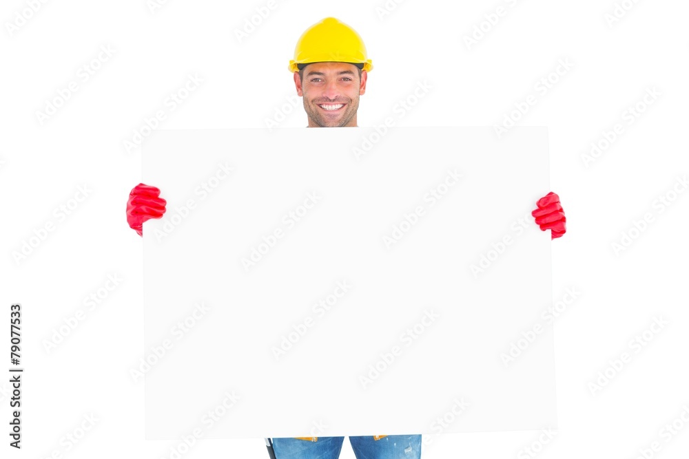 Portrait of handyman showing blank placard Portrait of handyman showing blank placard