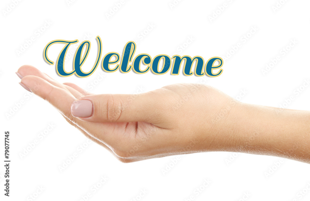 Female hand with word Welcome isolated on white Female hand with word Welcome isolated on white