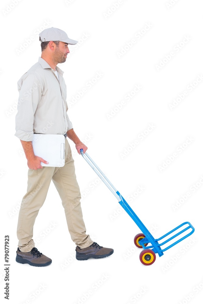 Delivery man pushing empty trolley on white background Delivery man pushing empty trolley on white background