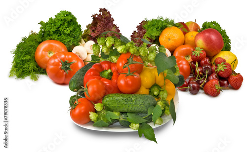 many fresh vegetables and berries on a plate