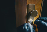 close up burglar picking a lock