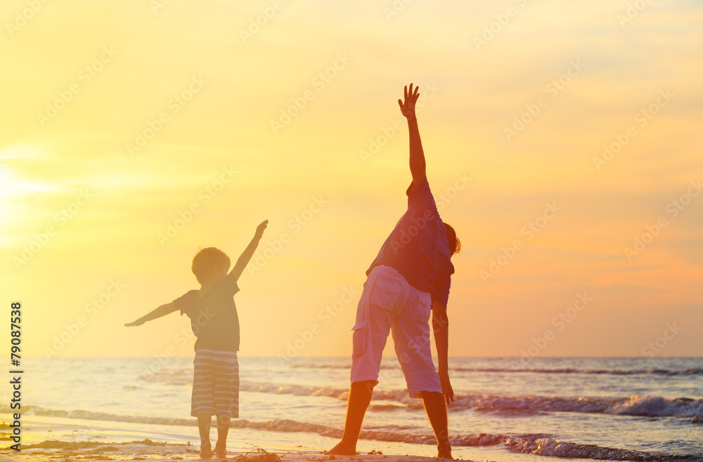 Fototapeta premium father and son having fun at sunset