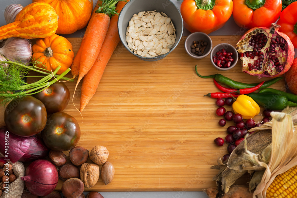 Closeup on autumn vegetables on cutting board Closeup on autumn vegetables on cutting board