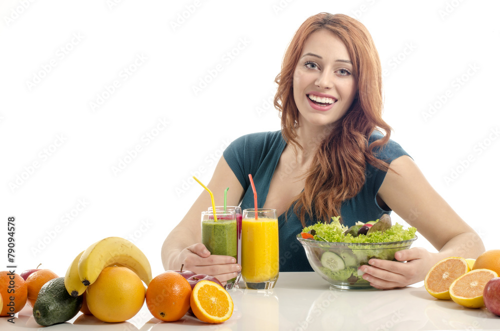 Woman having a table full of organic food,salad,juices,smoothie Woman having a table full of organic food,salad,juices,smoothie