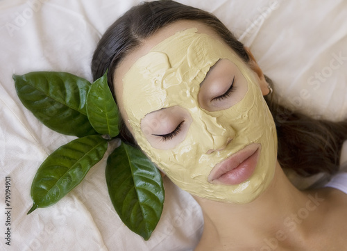 Woman with Indian Multani Matti clay facial mask, beauty spa photo