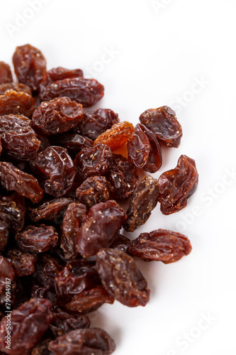 Pile of healthy raisins isolated on white background