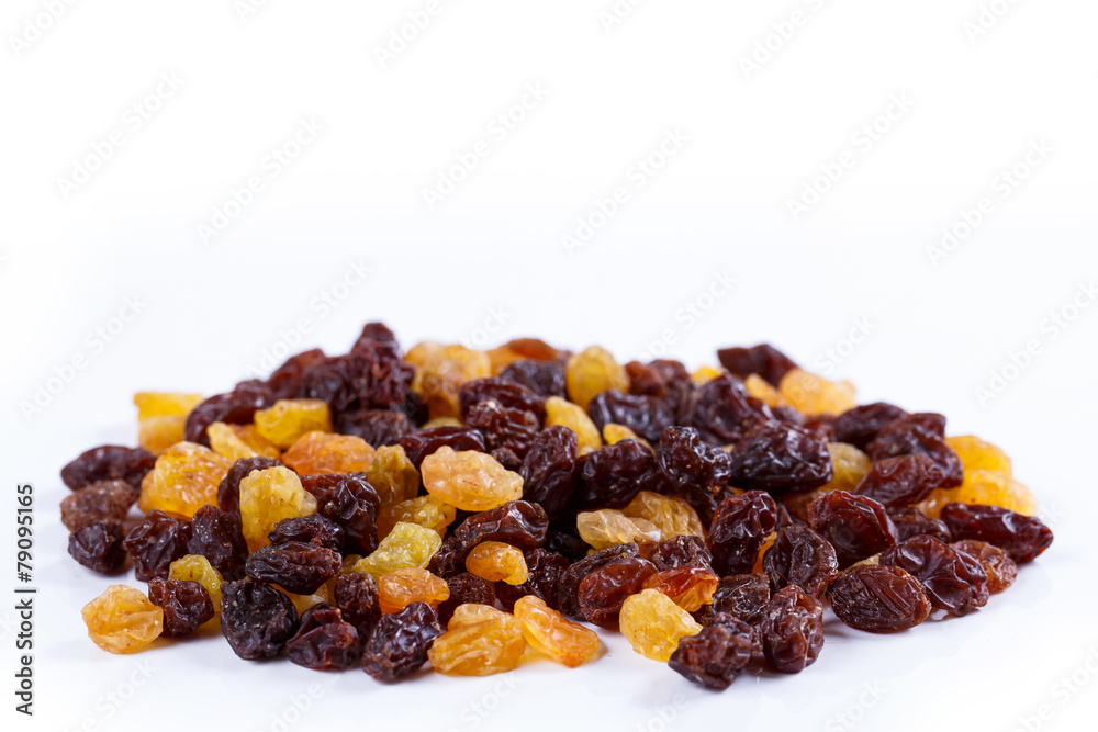 Obraz premium Heap of sultana raisins on white background