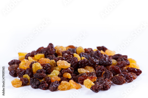 Heap of sultana raisins on white background