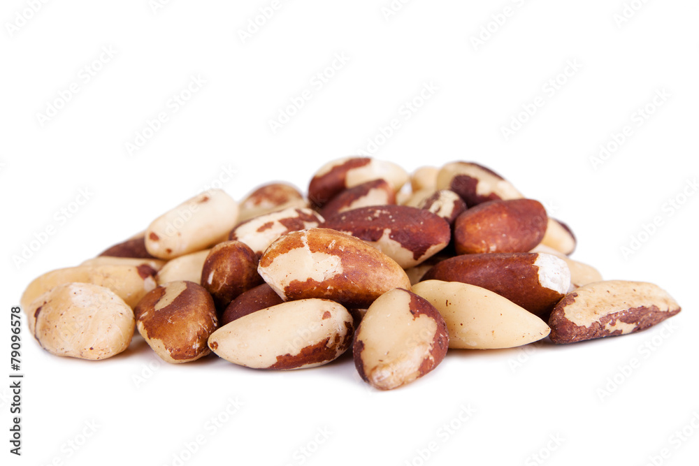Five big, beautiful, Brazilian walnut on a white background. Five big, beautiful, Brazilian walnut on a white background.