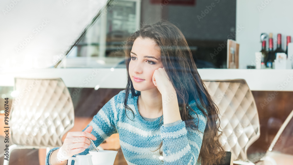 Young woman at the cafe