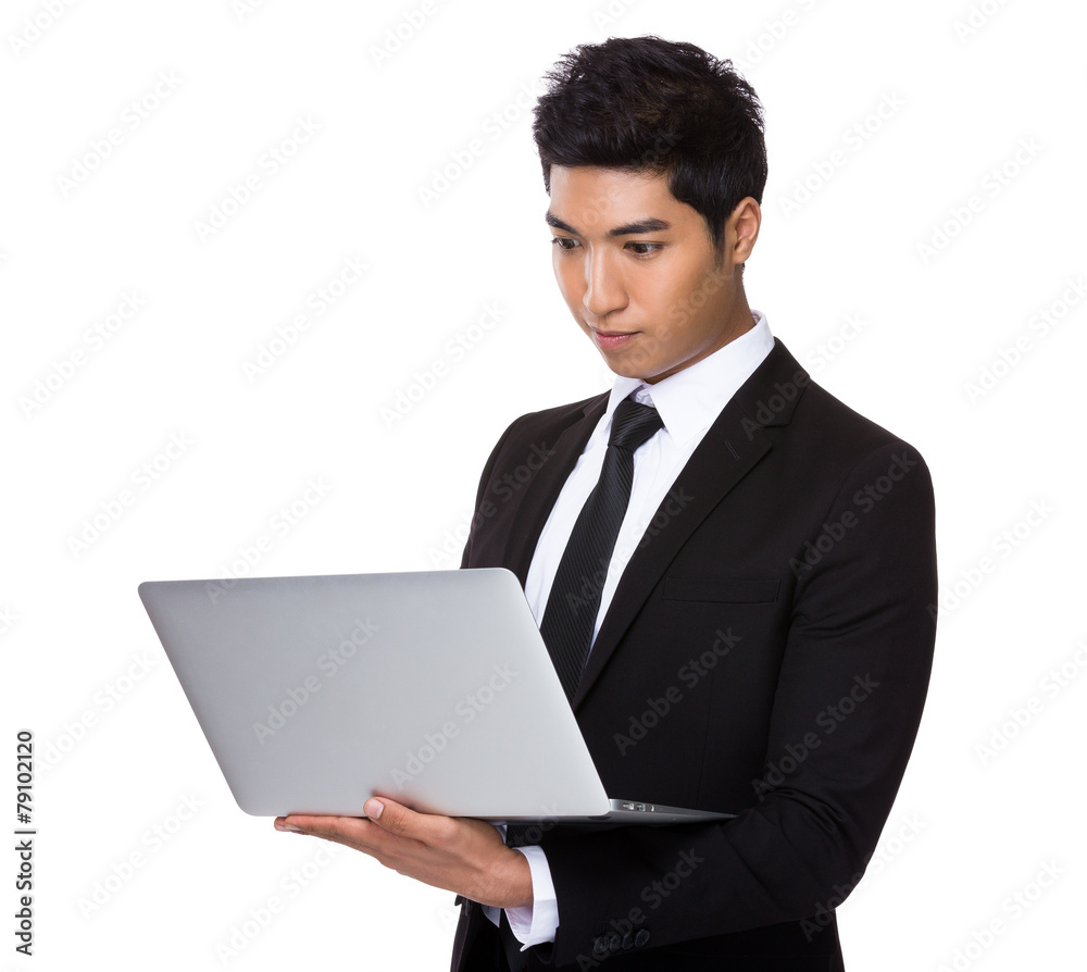 Mixed Indian businessman use of laptop