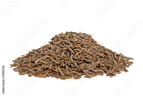 Pile of cumin seeds on a white background