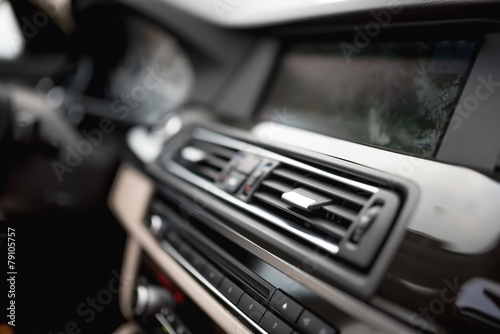 modern car interior with close-up of ventilation system holes © aboutmomentsimages