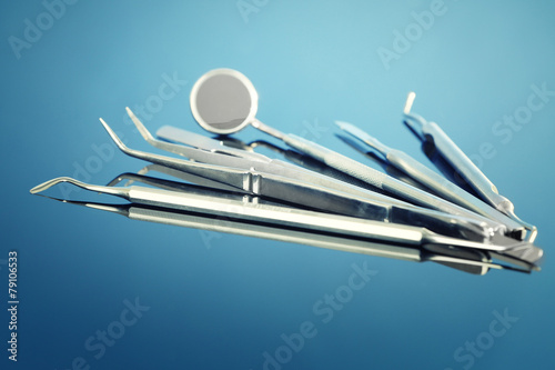 Dentist tools on blue background