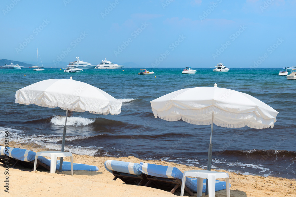 Beach with parasols and beds