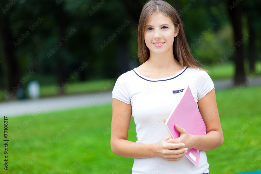 Smiling female student at the park Smiling female student at the park