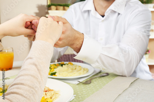 People praying before eating