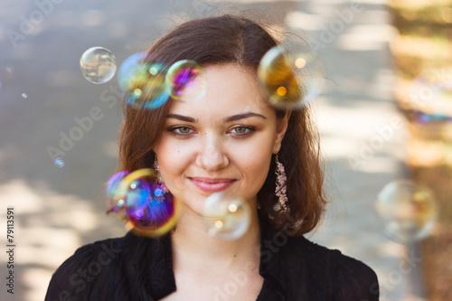 Girl and soap bubbles. Emotional portrait