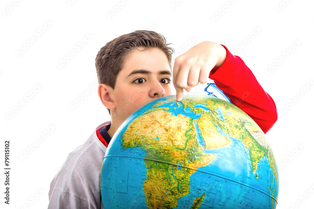 Caucasian boy hidden behind globe points index finger Caucasian boy hidden behind globe points index finger