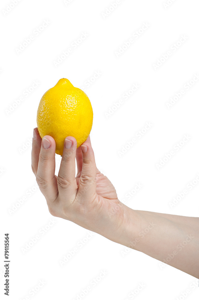 Lemon in a female hand. In isolation.. Lemon in a female hand. In isolation..