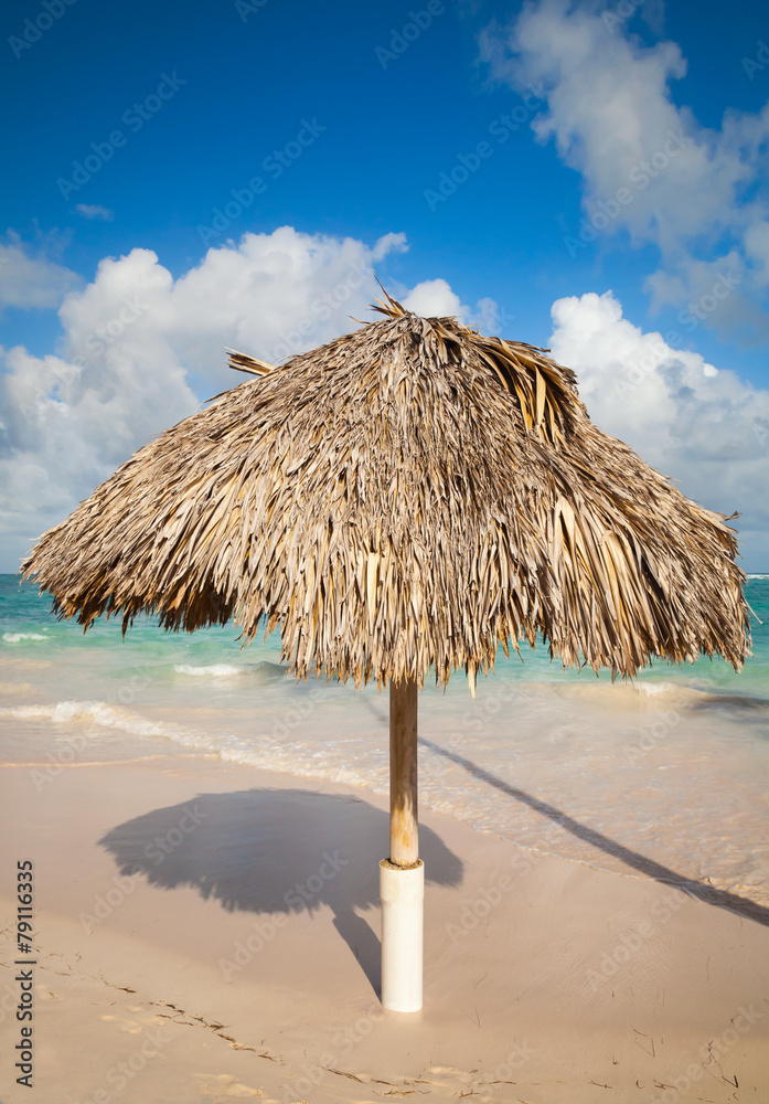 Wooden umbrella on the beach in Dominican republic