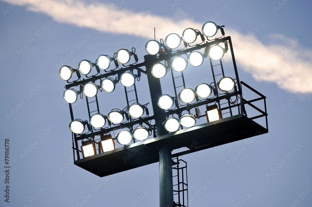 Naklejka premium Stadium lights at sunset
