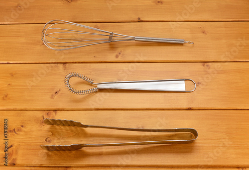 Balloon and sauce whisks and metal tongs