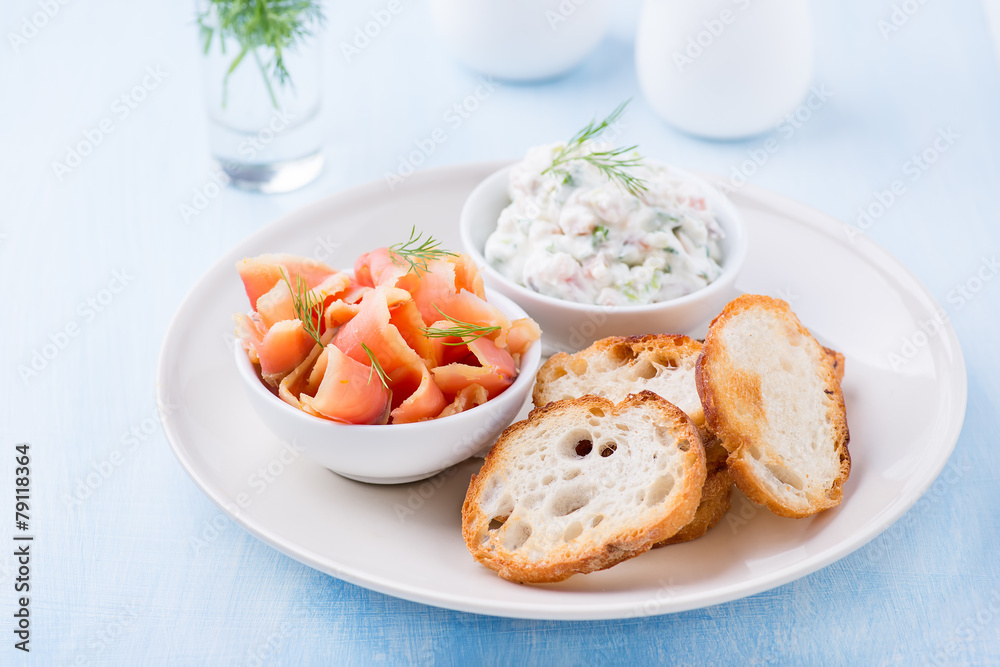 Smoked wild salmon, baguette and soft cheese spread with herbs Smoked wild salmon, baguette and soft cheese spread with herbs