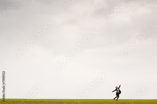 Girl jumping in field