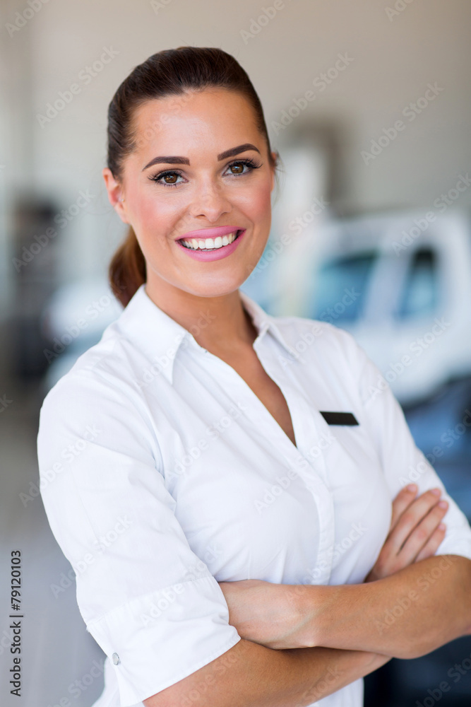 saleswoman standing at car dealership saleswoman standing at car dealership