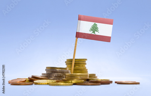 Flag of Lebanon in a stack of coins.(series) photo