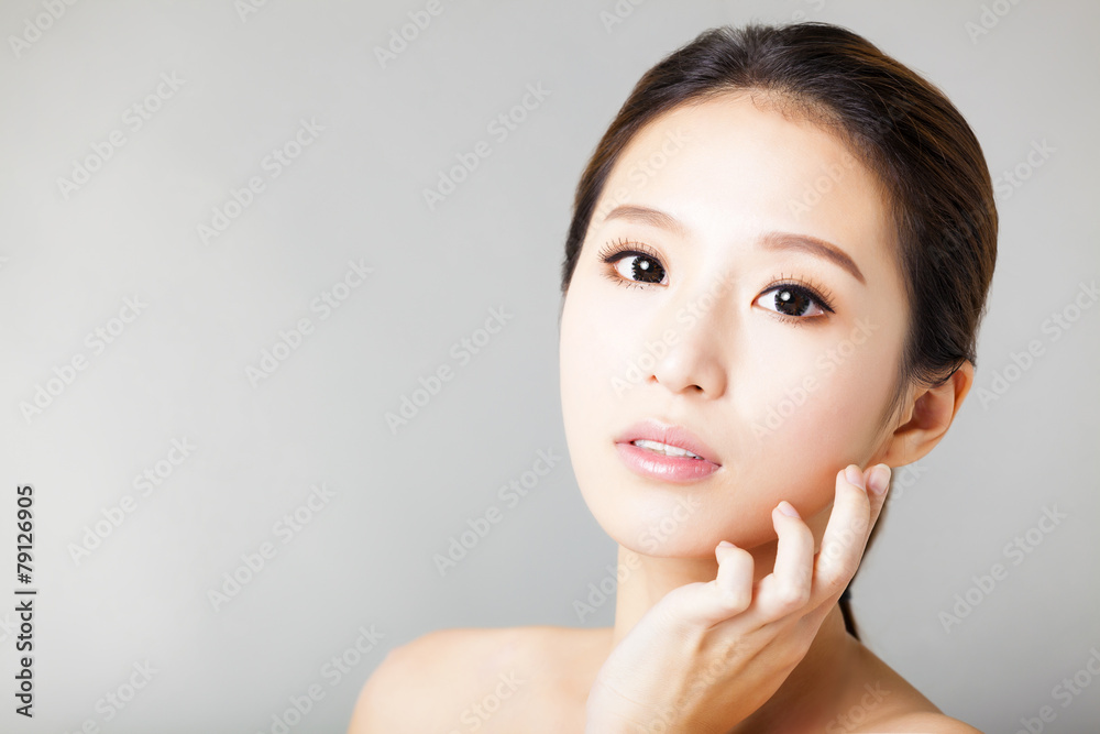 closeup young beautiful woman face closeup young beautiful woman face