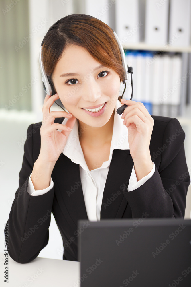 young businesswoman with headset working in office young businesswoman with headset working in office