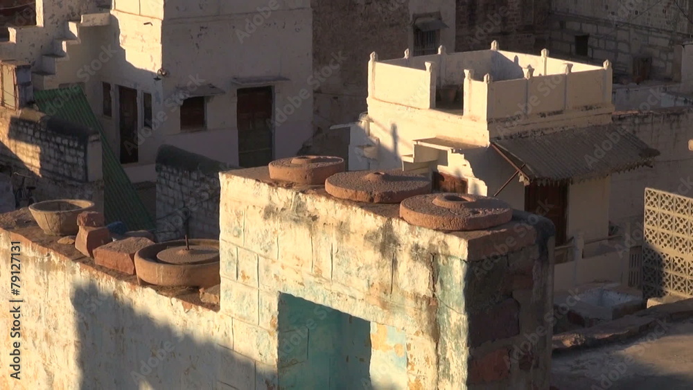 old millstone grindstone on house wall In Jodphur, Rajasthan