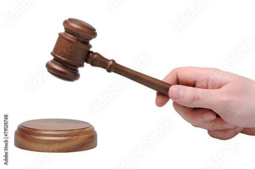 Hand with gavel on a white background