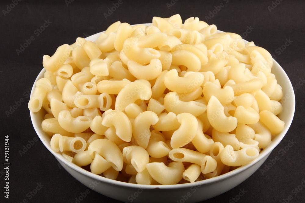 Bowl of uncooked pasta Bowl of uncooked pasta