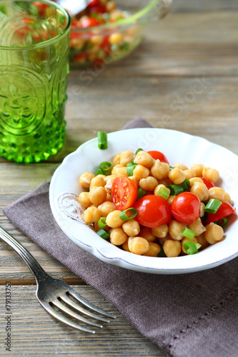 Salad with boiled chickpeas and tomatoes