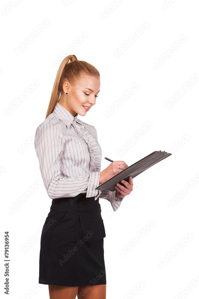 Happy smiling cheerful young businesswoman writing on clipboard Happy smiling cheerful young businesswoman writing on clipboard