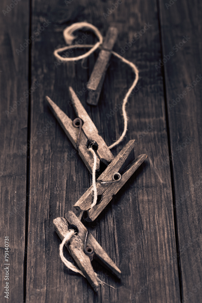 Old wooden pegs on wooden table Old wooden pegs on wooden table