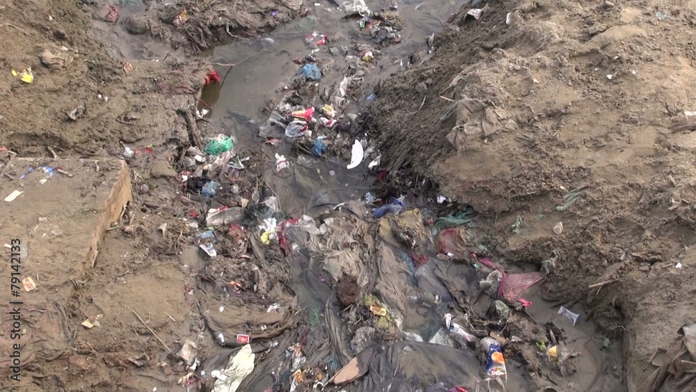 polluted open sewerage channel on Ganges coast in Varanasi