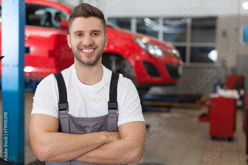Smiling mechanic in auto repair shop