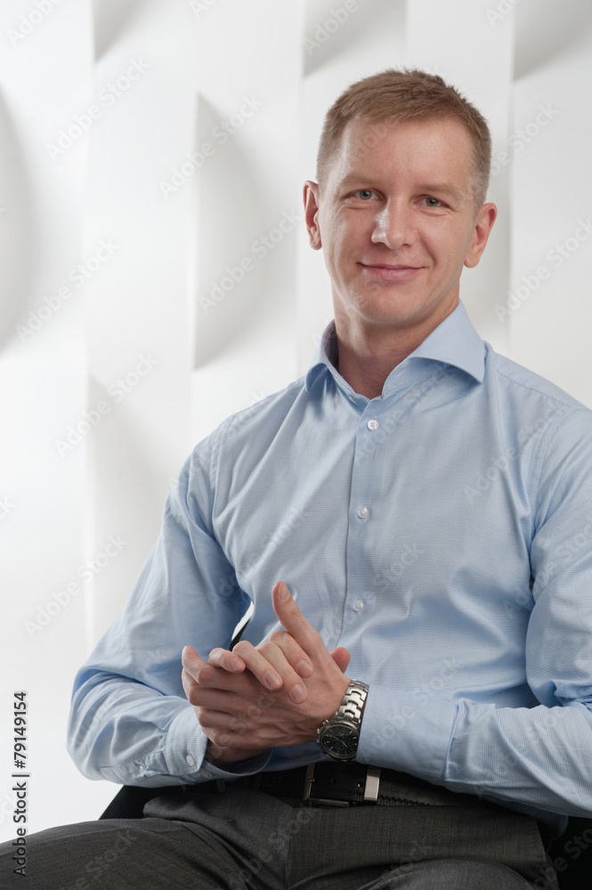 Happy Business man sits in modern urban office Happy Business man sits in modern urban office