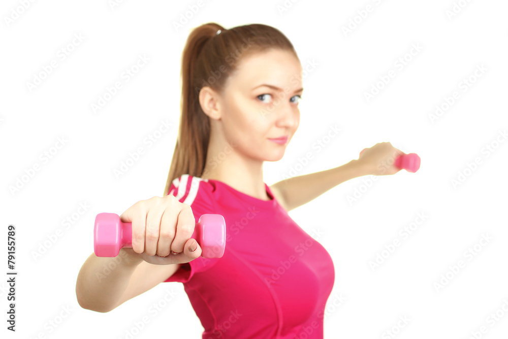 Girl in a tracksuit with dumbbells in hands isolated Girl in a tracksuit with dumbbells in hands isolated