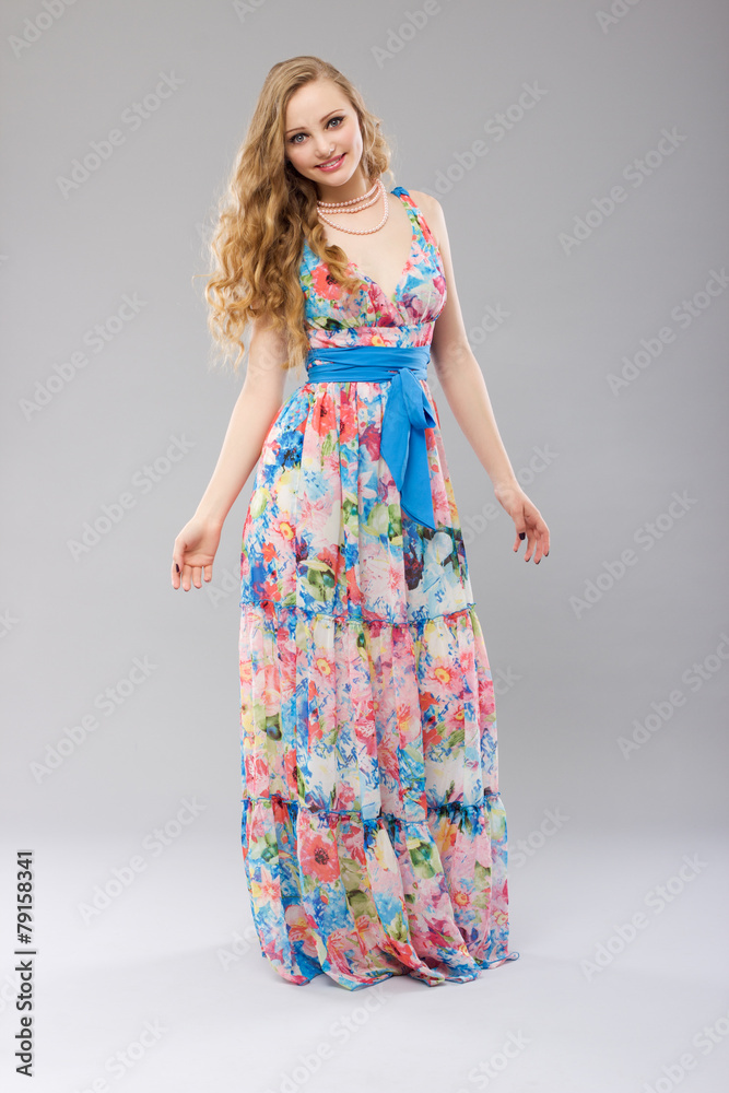 Beautiful young woman in a long dress color. Beautiful young woman in a long dress color.