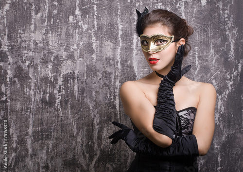young woman in carnival mask photo