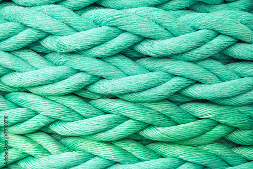 Green nautical rope, close-up background texture