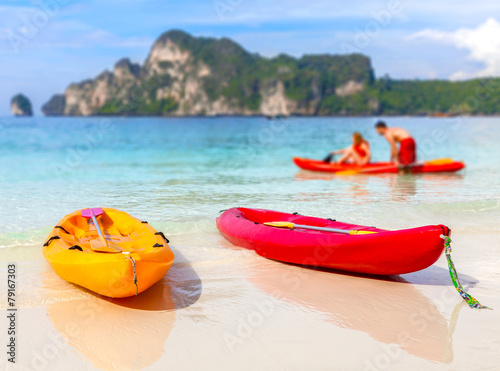 Kayaks on a tropical beach, shallow depth of field, Railay, Thailand.