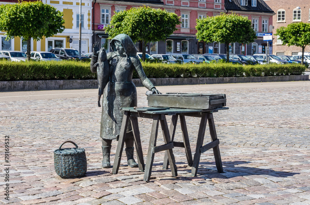 Statue of woman selling fish in Karlskrona. - obrazy, fototapety, plakaty 