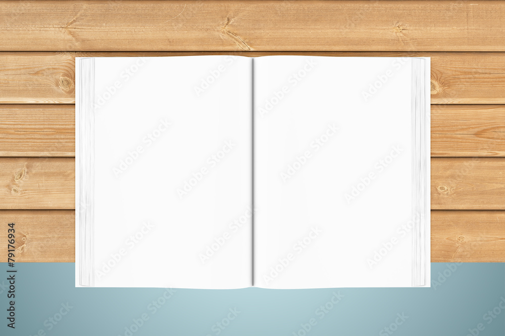 White blank open book on wooden planks White blank open book on wooden planks